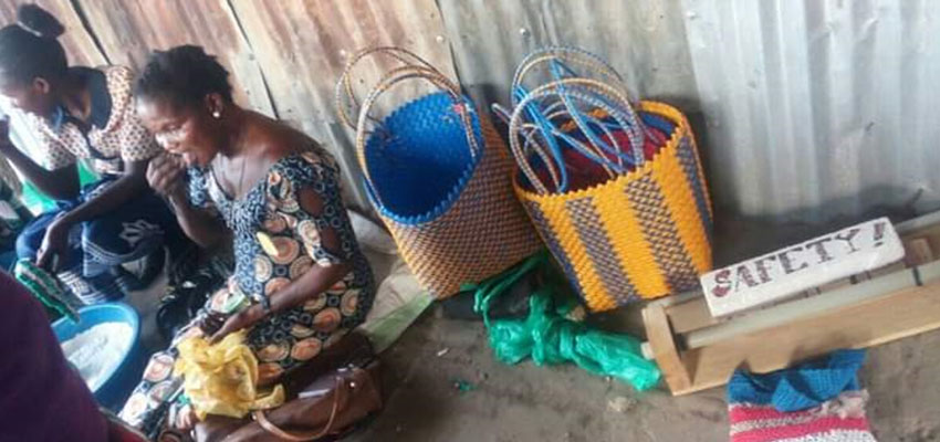 Women weaving bags to sell in Rhino Camp. Photo: Vivian Amuna